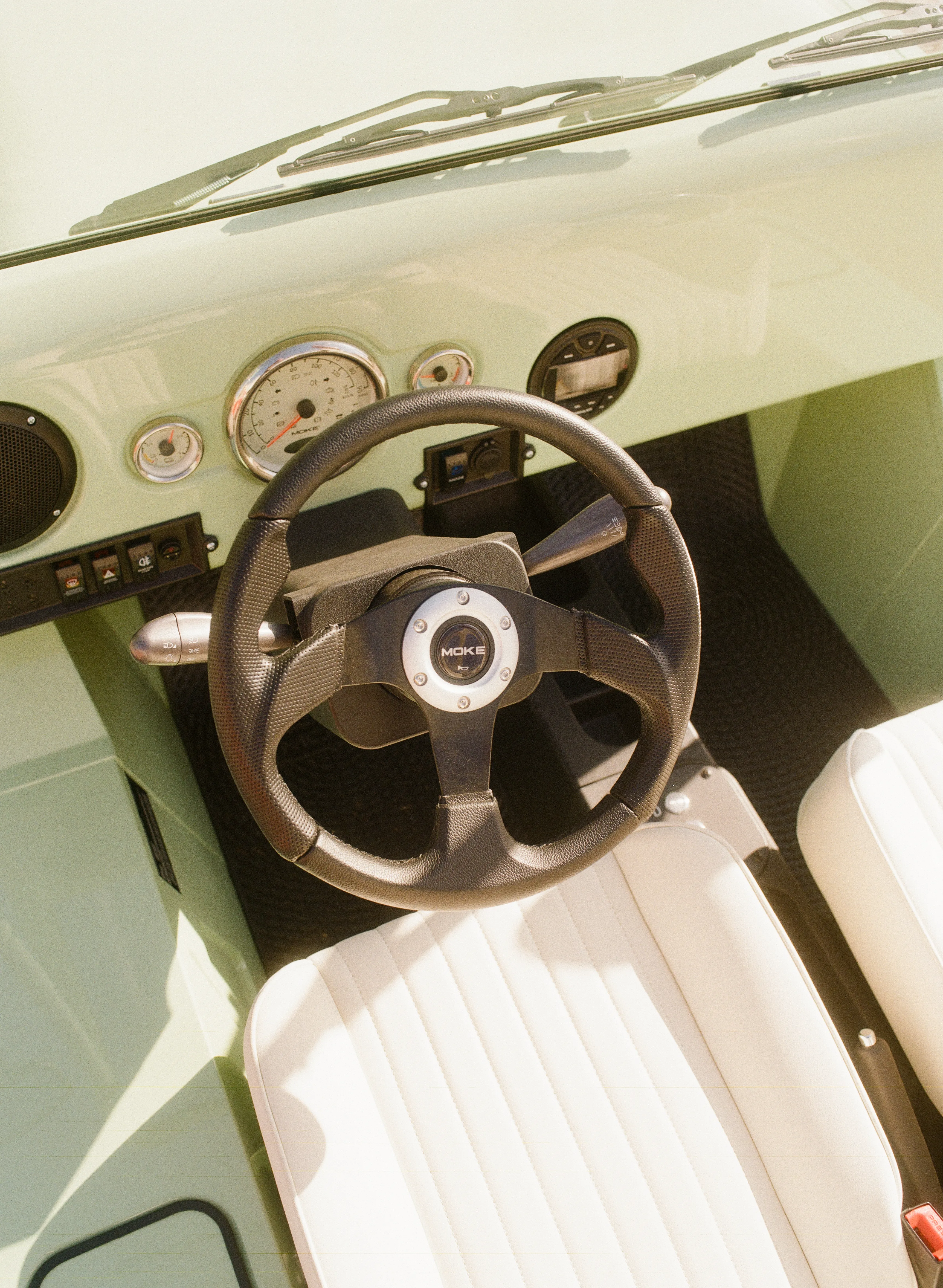 Moke parked at a tropical resort entrance
