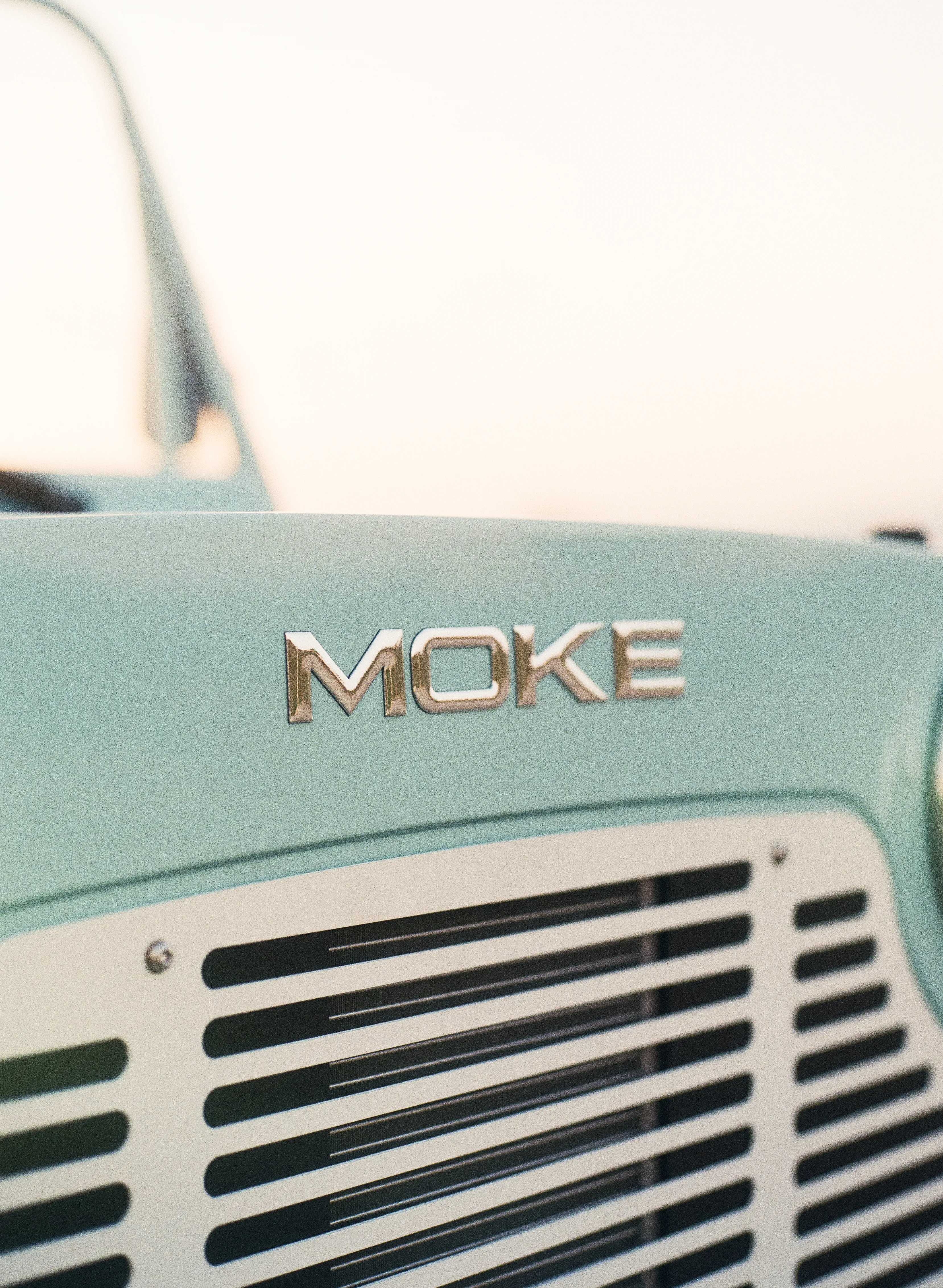 MOKE chrome badge at golden hour