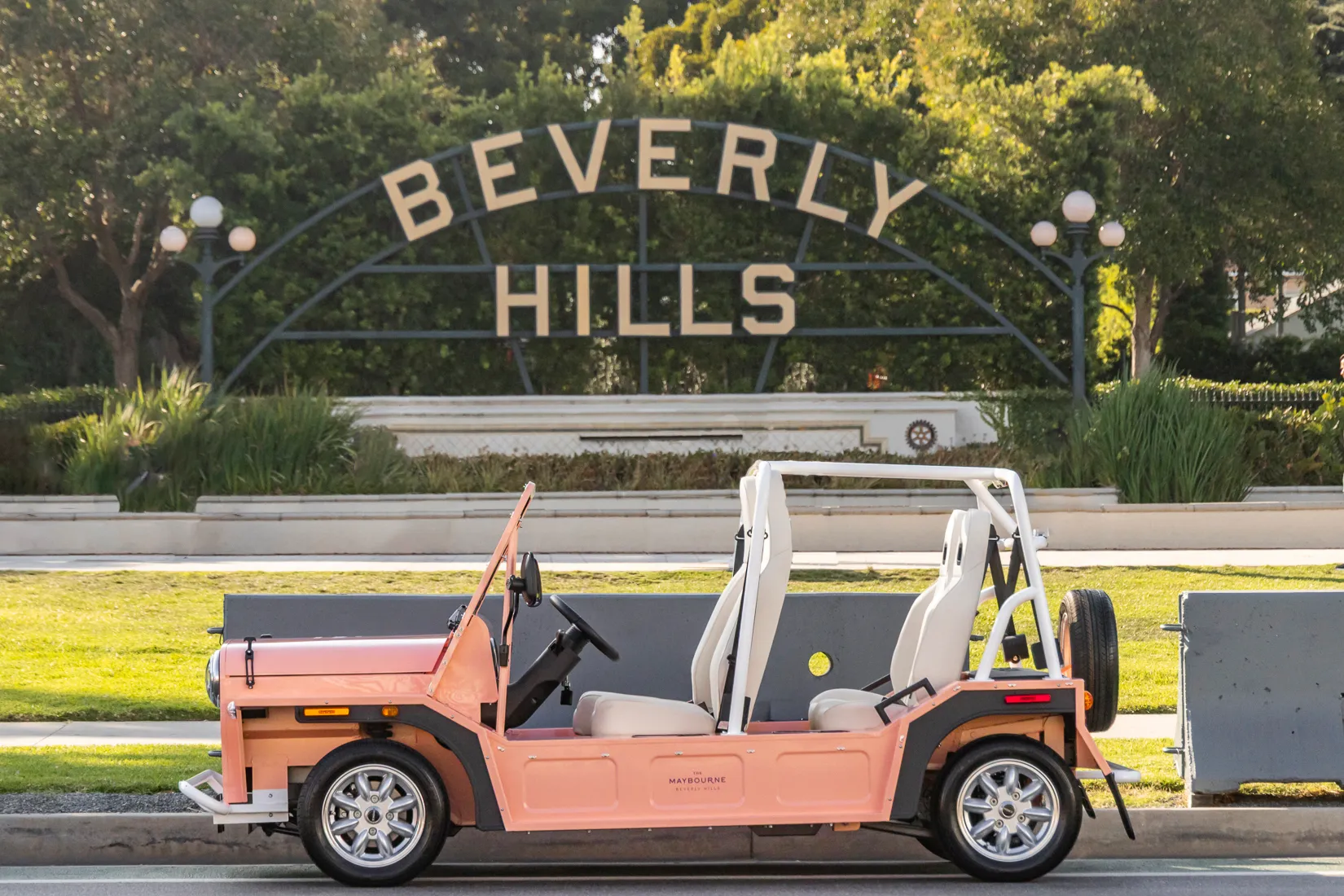 Maybel parked in profile in front of the Beverly Hills sign
