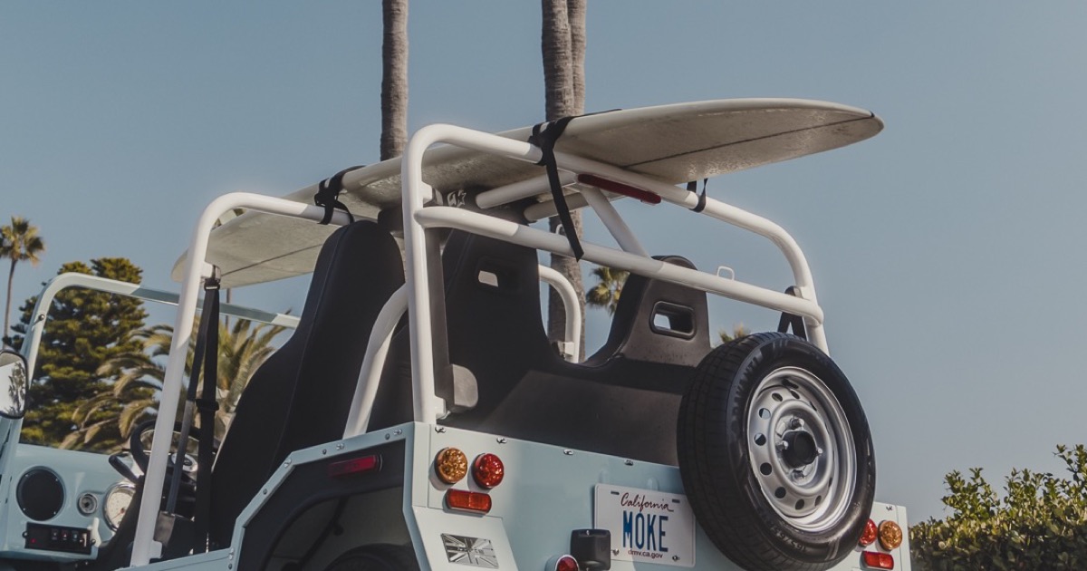 Ohana Mobility — Premium Moke EV fleet on a coastal road